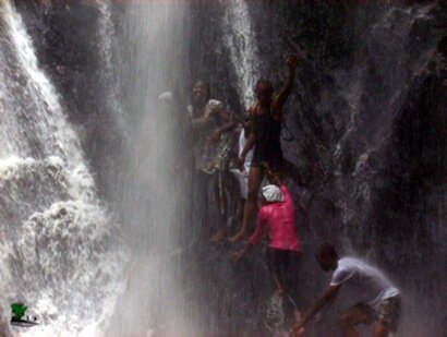 dunni having fun with other tourists beneath the second cascade