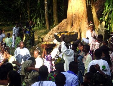 Worshippers carrying the calabash of sacrifice to the river banks