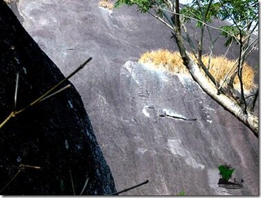 The rock bearing the Ifa inscription at Iho Eleeru, The Cave of Ashes